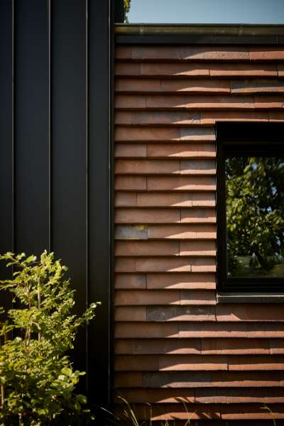 Architect pays attention to the details in a villa with a natural view and façade cladding in steel and stone, Konsul Lorenzen Straße 5, 24376 Kappeln, Germany
